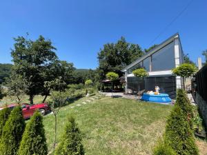 a house with a swimming pool in a yard at Villa fg in Gjilan
