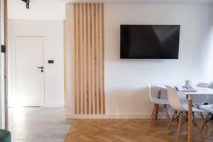 Televízia a/alebo spoločenská miestnosť v ubytovaní Krupówki i Styl, Krupówki Inn i Studio Miła w Centrum przy Krupówkach APARTZAKOP