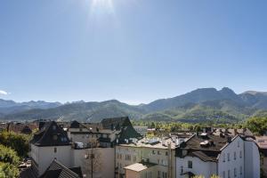 a view of a city with mountains in the background at Studio Miła i Nido w Centrum APARTZAKOP in Zakopane