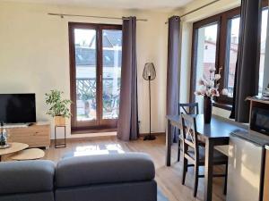 a living room with a couch and a table at Apartmány Zaky in Vrbov