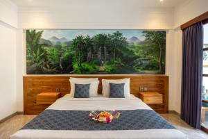 Postel nebo postele na pokoji v ubytování De Rekun Ubud