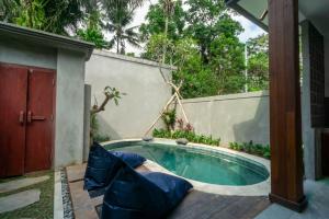 Bazén v ubytování De Rekun Ubud nebo v jeho okolí
