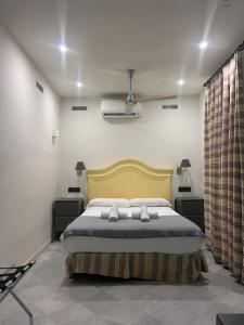 Łóżko lub łóżka w pokoju w obiekcie Turistic Apartment Sevillanos SL