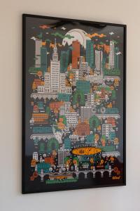 a cityscape painting of a city on a wall at Sunny City Centre Apartment by Renters in Warsaw