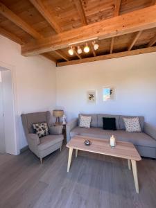 a living room with a couch and a coffee table at Finca Los Ángeles in Trapiche