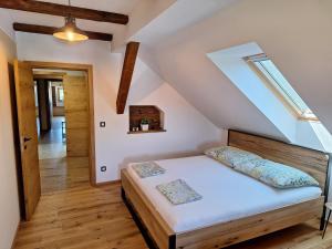 a bedroom with a bed in a attic at Vila Trate in Križevci pri Ljutomeru