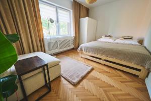 Postel nebo postele na pokoji v ubytování Studio Loft Winnica Sopel
