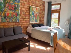Postel nebo postele na pokoji v ubytování House of Sun