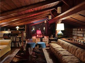 a living room with a couch and a table at CHALET MARMONT ROME in Rome