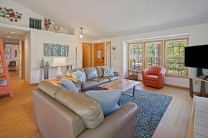 a living room with a couch and a table at 1 Sunrise in Sunriver
