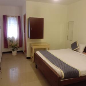 Olive Rooms Kodaikanal with WiFi, Spacious Rooms, Parking, Nearby Homemade Food 객실 침대
