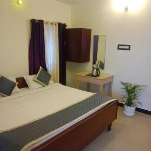 Olive Rooms Kodaikanal with WiFi, Spacious Rooms, Parking, Nearby Homemade Food 객실 침대