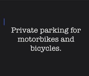 a sign that reads private parking for motorcycles and bicycles at Green house, 1 bedroom & 1 kitchen apartment, located in Elbasan city center in Elbasan