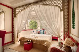 Letto o letti in una camera di Sarang Palace - A Luxury Boutique Hotel