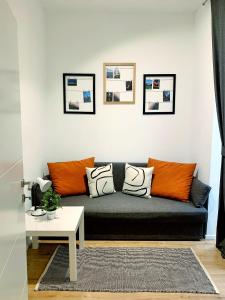 a living room with a couch and a table at Ferienwohnung Diefenbachgasse in Vienna