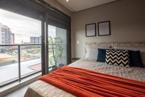 Ένα ή περισσότερα κρεβάτια σε δωμάτιο στο Inn Joy 506 no Parque Una