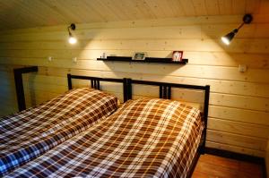 Postel nebo postele na pokoji v ubytování Guest House U Pruda