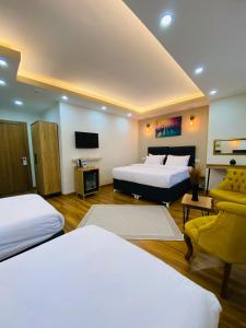 A bed or beds in a room at PALMERA ART HOUSE