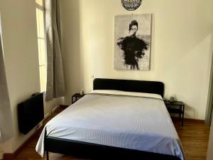 Postel nebo postele na pokoji v ubytování République - Grande la Réal