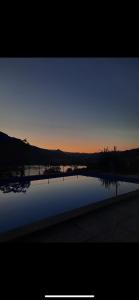 vista di una cassa d'acqua al tramonto di Appartamento HAPPY DAYS (CIPAT: 022139-AT-837180) a Pergine Valsugana