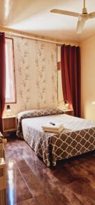A bed or beds in a room at Casa de Huespedes Dolce Vita