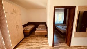Posteľ alebo postele v izbe v ubytovaní Penzion Ranch
