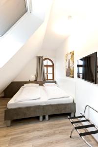 Ένα ή περισσότερα κρεβάτια σε δωμάτιο στο Vinotel Weinstrasse +57 φωτογραφίες