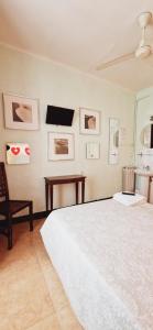 A bed or beds in a room at Casa de Huespedes Dolce Vita