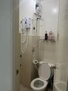 a small bathroom with a toilet and a shower at San Jose Residencias / enchanted kingdom / nuvali / slex / sta. rosa / paseo in Santa Rosa