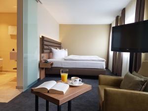 Postel nebo postele na pokoji v ubytování Hotel Ross + 37 fotografií
