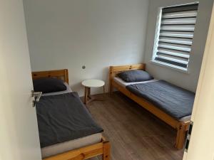 Postel nebo postele na pokoji v ubytování Gästewohnung gesamte Unterkunft- TV- Internet