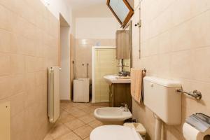 a bathroom with a white toilet and a sink at Casa Relax Salento - Relax House in the village in Specchia +39 photos