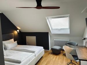 Postel nebo postele na pokoji v ubytování DK Hotel Heidelberg