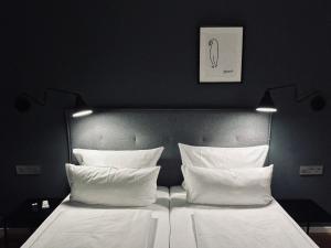 Postel nebo postele na pokoji v ubytování DK Hotel Heidelberg