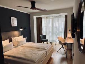 Postel nebo postele na pokoji v ubytování DK Hotel Heidelberg