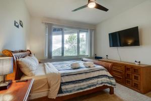 a bedroom with a bed with a flat screen tv at Ski-InandSki-Out Wintergreen Resort Condo with Patio! in Mount Torry Furnace