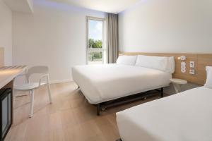 Postel nebo postele na pokoji v ubytování B&B HOTEL Lleida + 19 fotografií