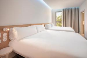 B&B HOTEL Lleida客房内的一张或多张床位