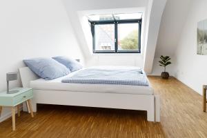 En eller flere senge i et værelse på Ferienwohnung Sonnenschein in Flensburg, Sonwik + 31 billeder