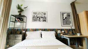 Postel nebo postele na pokoji v ubytování Aurora Guest House- Dimore Bolognesi