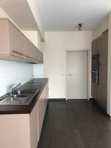 a kitchen with a sink and a counter top at Central Oasis near Brussels / Airport in Kortenberg