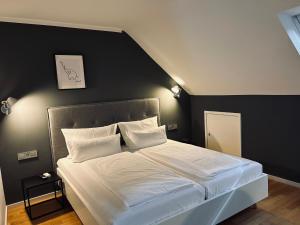 Postel nebo postele na pokoji v ubytování DK Hotel Heidelberg