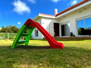 a slide in a yard in front of a house at luxury villa rentals in tetùan in Tetouan