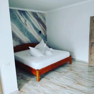 Un pat sau paturi într-o cameră la Vila katherina