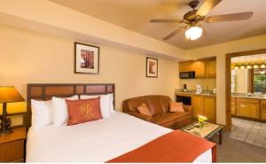 a bedroom with a bed and a living room at Westgate Smoky Mountain Resort & Water Park in Gatlinburg