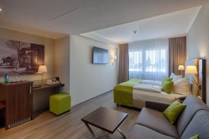 TV a/nebo společenská místnost v ubytování hotel bomonti Nürnberg West
