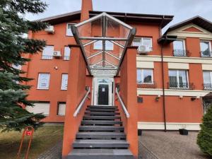 a staircase in front of a building with a building at Perlos Apartamentai 13 in Birštonas