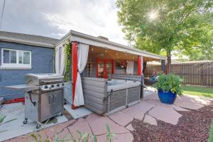 a backyard kitchen with a grill and a house at Cozy Denver Home with Hot Tub, 2 miles to Dtwn! in Wheat Ridge