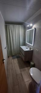 a bathroom with a sink and a toilet and a mirror at Casa Higopico in Tacoronte +20 photos