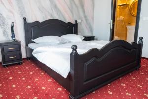 Giường trong phòng chung tại Villa Harry
